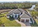 Single-Gathering home with water access, tile roof, and large yard at 609 Colonial Bay Dr, Nokomis, FL 34275