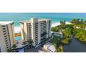 Oceanfront property with lush landscaping and private pool at 19 Whispering Sands Dr # 1204, Sarasota, FL 34242