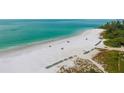 Private beach access with lounge chairs and umbrellas at 19 Whispering Sands Dr # 1204, Sarasota, FL 34242