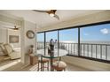Ocean view dining area with glass table and comfortable seating at 19 Whispering Sands Dr # 1204, Sarasota, FL 34242