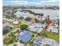 Aerial view showing home's location near waterway and pool at 5891 Tidewood Ave # 1, Sarasota, FL 34231