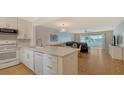 Modern kitchen with white cabinets and quartz countertops at 119 Tidewater Dr # 119, Bradenton, FL 34210