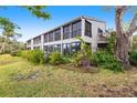 Rear view of condo building highlighting the building's length and private balconies at 1611 Clower Creek Dr # Ha236, Sarasota, FL 34231