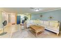 Open concept living space with a sectional sofa and view into the kitchen at 3029 Homasassa Rd, Sarasota, FL 34239