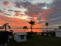 Stunning sunset over calm water; peaceful waterfront property at 4528 106Th W St, Bradenton, FL 34210
