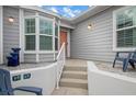 Inviting front entry with steps leading to the front door and a small patio area at 502 Woodstork Cir, Bradenton, FL 34209