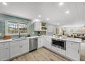 Modern white kitchen with stainless steel appliances at 635 Jamaica E Cir, Apollo Beach, FL 33572