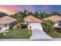 Attractive single-Gathering home with a two-car garage, nicely landscaped yard, and desirable curb appeal at 8472 Gateway Ct, Englewood, FL 34224