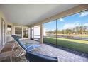 Relaxing screened porch overlooking a tranquil lake at 11907 Petunia Ter, Bradenton, FL 34212