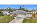 Single story home with attached garage and fenced backyard at 161 Sandhurst Dr, Venice, FL 34293