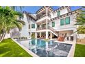 Large rectangular pool and spa with a spacious backyard at 6506 Gulf Dr, Holmes Beach, FL 34217