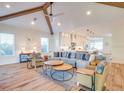 Bright and airy living room with vaulted ceilings and hardwood floors at 9403 Gulf Dr, Anna Maria, FL 34216