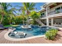 Resort-style pool with a spa and expansive wooden deck at 9403 Gulf Dr, Anna Maria, FL 34216