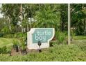 Turtle Bay community entrance sign at 8701 Midnight Pass Rd # 106A, Sarasota, FL 34242
