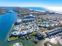 Aerial view of waterfront community, showing home location, pool, and marina at 1325 Siesta Bayside Dr # 1325B, Sarasota, FL 34242