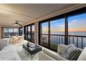 Bright living room with water views and comfortable seating at 1600 W Marion Ave # 213, Punta Gorda, FL 33950