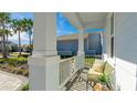 Relaxing front porch with seating and tropical plants at 16511 Cornwall Ln, Bradenton, FL 34202