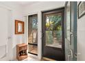 Bright and airy front entryway with a view to a garden at 1704 Pelican Cove Rd # T138, Sarasota, FL 34231