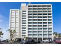 Condo building exterior showcasing architectural details and parking at 4822 Ocean Blvd # 8B, Sarasota, FL 34242