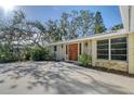 House exterior with double wooden doors at 640 Venice Ln, Sarasota, FL 34242