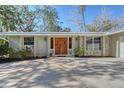 House exterior featuring a double wooden door at 640 Venice Ln, Sarasota, FL 34242