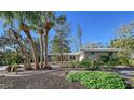 Well-maintained landscaping surrounds this lovely house at 640 Venice Ln, Sarasota, FL 34242