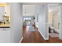 View down hallway showing kitchen, living room and bathroom at 1100 Capri Isles Blvd # 522, Venice, FL 34292