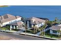 Luxury waterfront home with expansive lake views and meticulously designed landscaping at 1206 Blue Shell Loop, Sarasota, FL 34240