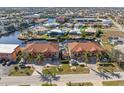 Two-story building with attached garages and a community view at 1323 Mediterranean Dr # 111, Punta Gorda, FL 33950