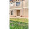 Townhouse exterior with walkway and landscaping at 1323 Mediterranean Dr # 111, Punta Gorda, FL 33950