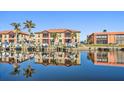 Waterfront property with boats docked and building reflections at 1323 Mediterranean Dr # 111, Punta Gorda, FL 33950