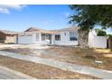One-story house with a two-car garage and landscaped yard at 8026 Barberry Dr, Port Richey, FL 34668