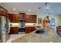 Spacious kitchen with stainless steel appliances and granite countertops at 1035 Bradberry Dr, Nokomis, FL 34275