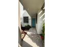 Inviting entryway with teal door and small courtyard at 226 Lakewood Dr # 226, Bradenton, FL 34210