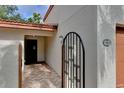 Brick walkway leads to the entrance with an iron gate at 3404 Falcon Pl, Bradenton, FL 34210