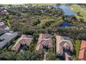 Aerial view of upscale homes, golf course, and lake at 3769 Caledonia Ln, Sarasota, FL 34240