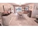 Charming dining room with table and chairs, and view to backyard at 2426 Nassau St, Sarasota, FL 34231