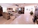 Bright living room features tile floors, comfy seating, and large windows at 2426 Nassau St, Sarasota, FL 34231