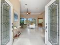 Bright and spacious entryway with tile floors and glass doors at 359 Turtleback Xing, Venice, FL 34292