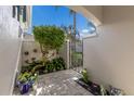 Small courtyard with gate and potted plants at 4004 Oakley Greene # 37, Sarasota, FL 34235