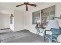 Small front porch with seating and a view of the yard at 430 Botticelli Dr # 430, Nokomis, FL 34275