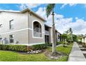 Condo building showcasing architectural details and landscaping at 5330 Hyland Hills Ave # 2311, Sarasota, FL 34241