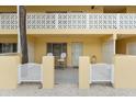 Condo building exterior showcasing a private entrance and patio at 5955 Midnight Pass Rd # 4E, Sarasota, FL 34242