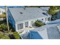 Back exterior showcasing patio, landscaping and water view at 1005 Ibis Ct, Bradenton, FL 34209