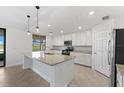Modern kitchen featuring granite countertops and island at 17825 Gawthrop Dr # 104, Bradenton, FL 34211
