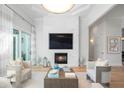 Spacious living room with fireplace and built-in media at 3260 Bayou Rd, Longboat Key, FL 34228