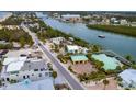 Bird's-eye view of waterfront home showcasing its location and surroundings at 411 S Casey Key Rd, Nokomis, FL 34275