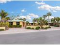 Beautiful waterfront home with a double garage and lush landscaping at 411 S Casey Key Rd, Nokomis, FL 34275
