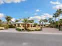 Attractive waterfront home with palm trees and a large driveway at 411 S Casey Key Rd, Nokomis, FL 34275