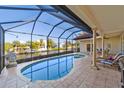 Relaxing pool area with canal views and screened enclosure at 4937 Oxford Dr, Siesta Key, FL 34242